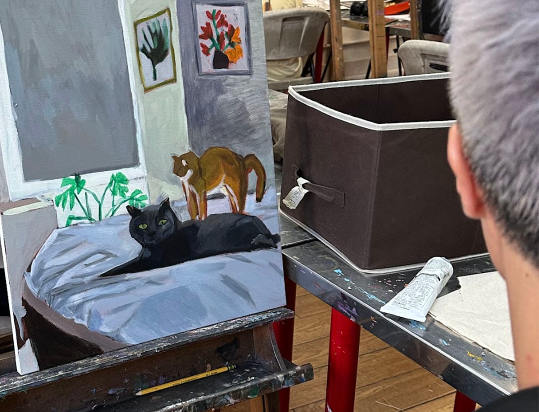 Adult art class project work in studio with painting and mixed media exploration