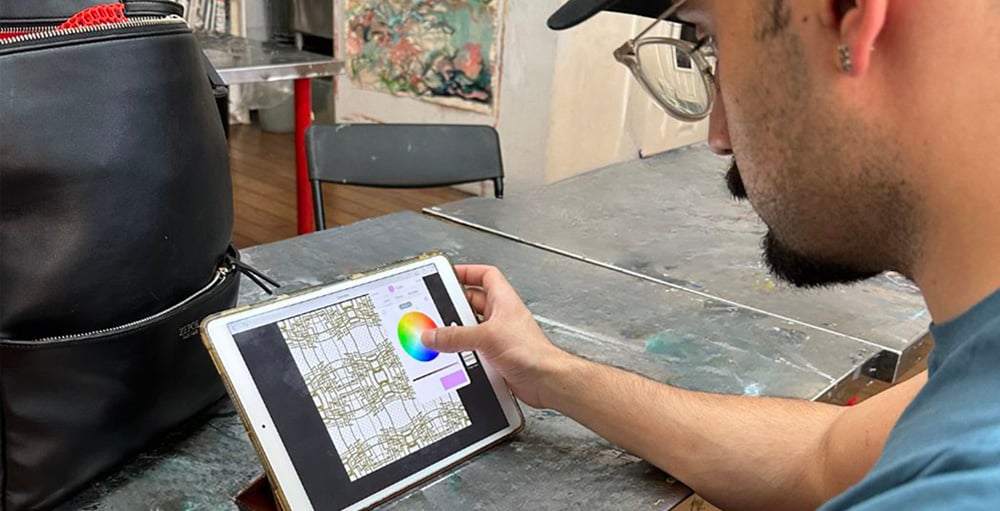 Advanced student working on digital design portfolio for professional art career in NYC
