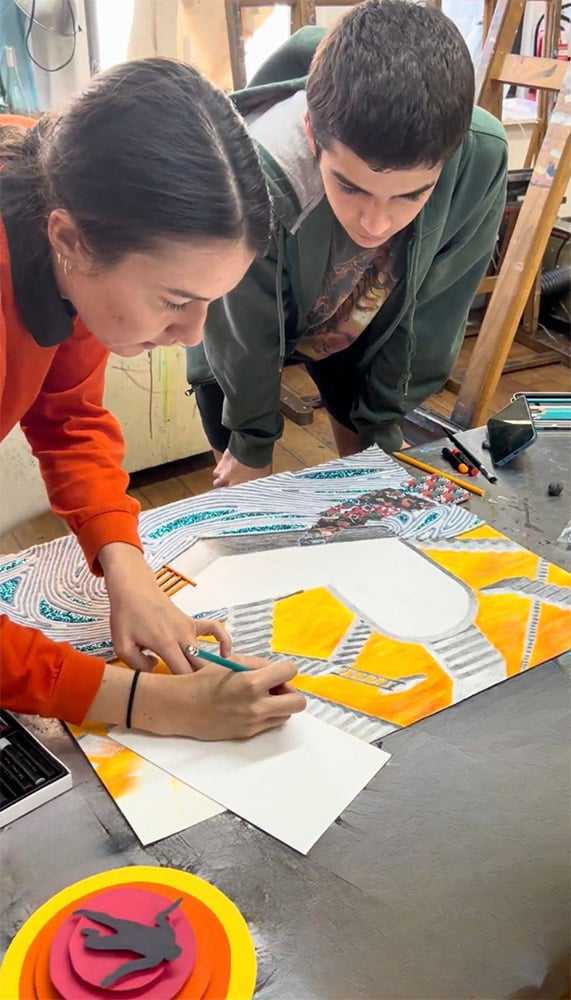 Students working on a mixed media drawing project in an art class at New York Art Studio in NYC